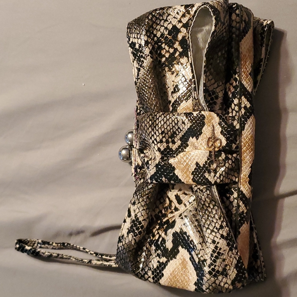 NWOT Jessica Simpson faux snake skin clutch.